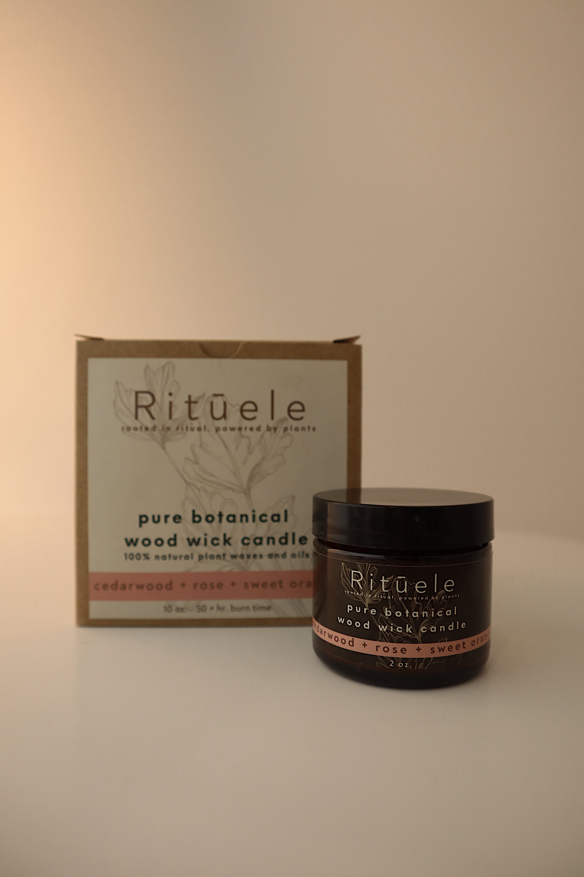 Example of a 10 ounce and 2 ounce Candle in the Cedarwood, rose, and sweet orange scent