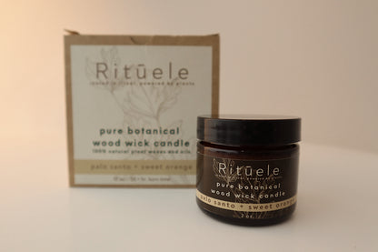 Photo showing two variants of the Palo Santo and sweet orange candle