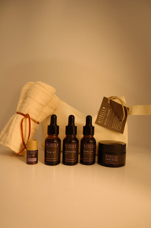 lavender travel pack with small body butter, sample body oil, lip balm, sample face oil, sample cleansing oil and towelettes 