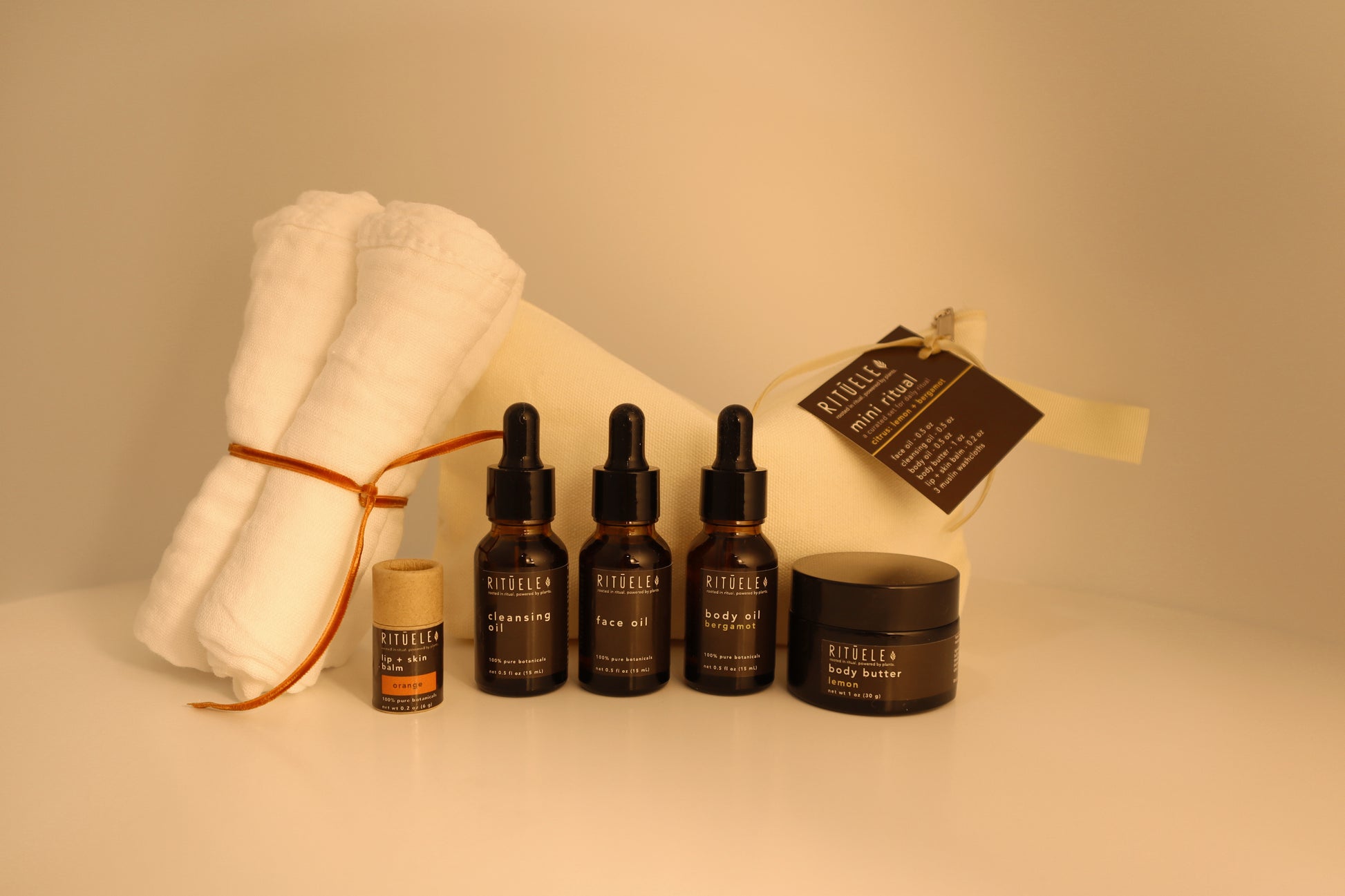 travel pack of small body oil, small face oil, small face cleansing oil, small body butter, small lip balm and 3 towelettes