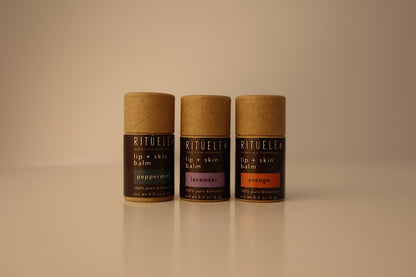 Three Rituele lip and skin balms on a beige background